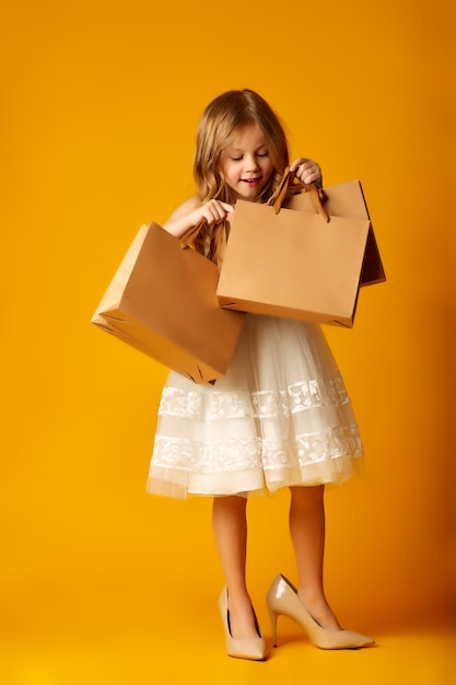 Side view of a little girl in stylish clothes