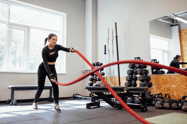 side view of man exercising in gym