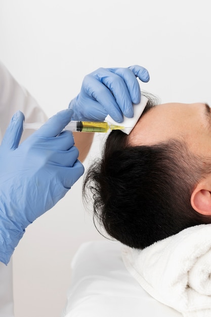 Side view man getting prp treatment