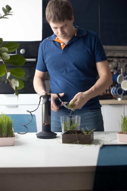 Side view of man holding coffee at home