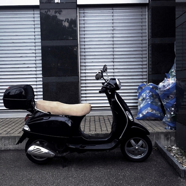 Side view of man riding bicycle on street