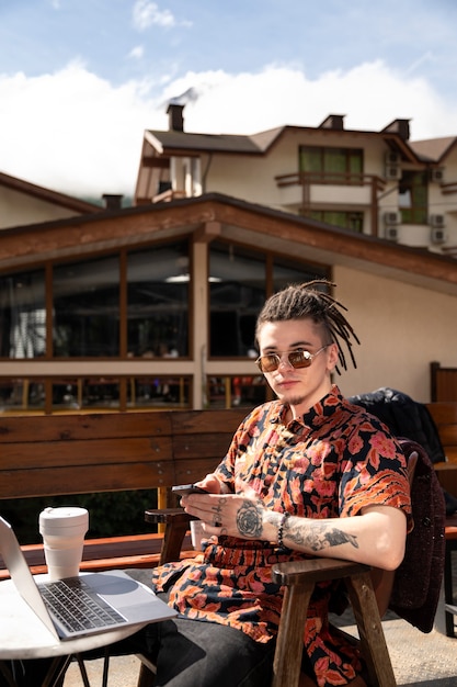 Side view man sitting at table