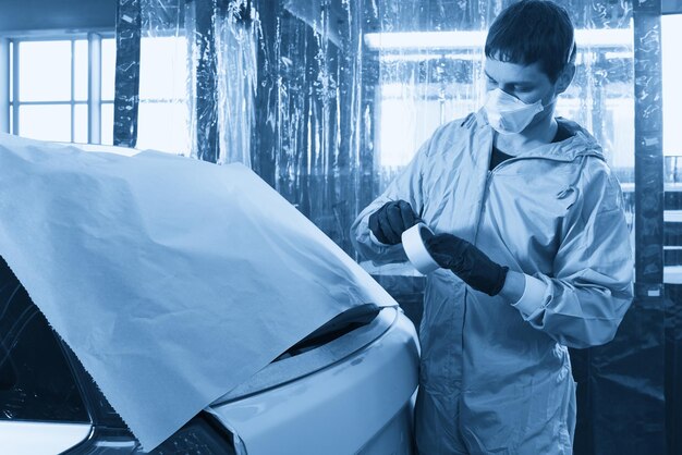 Side view of man standing in car