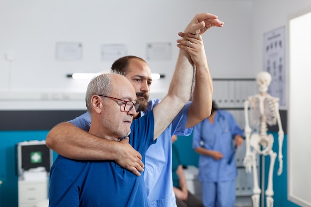 Side view of man with arms raised