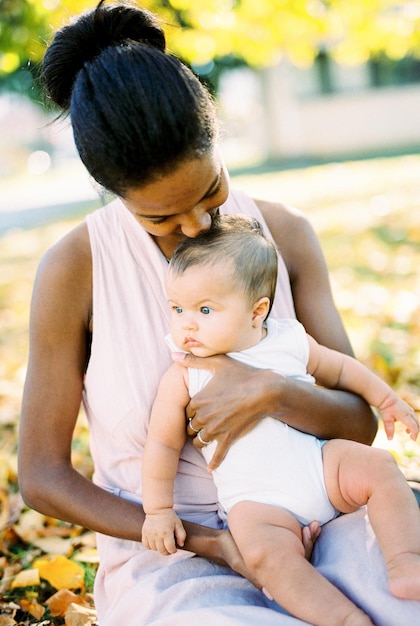 Side view of mother and daughter at park