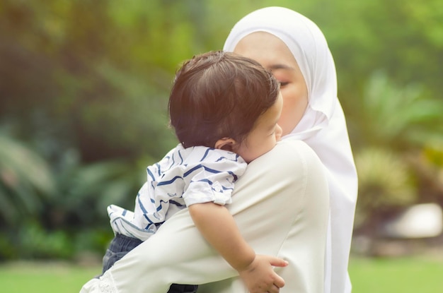 side view of mother with baby boy