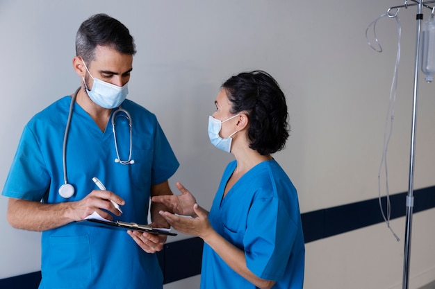 Side view nurses wearing scrubs