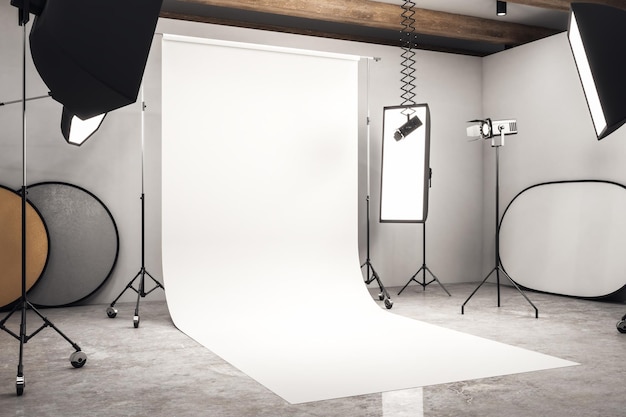 写真 白い背景にプロ仕様の機器とコンクリートの床を備えたモダンな写真スタジオのインテリアの側面図3dレンダリングをモックアップ