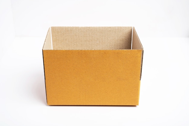 Side view of open brown cardboard box.