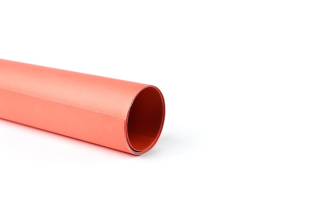 Side view of orange colored paper isolated on a white background