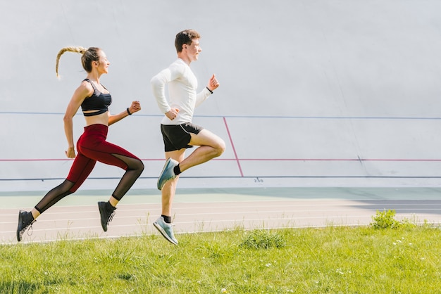 Side view of partners running