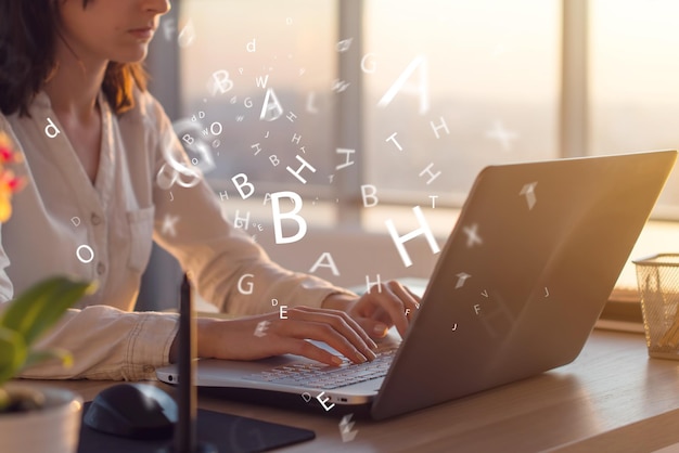 Side view photo of a female using laptop working typing surfing the internet at workplace