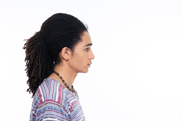 Side view portrait of afro american man isolated on a white wall