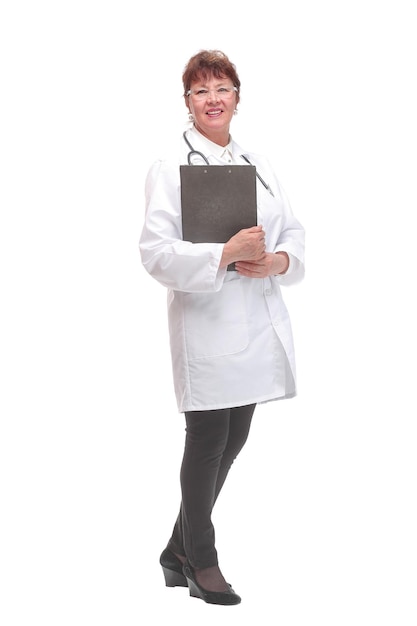 Side view portrait of senior female doctor on white background holding clipboard