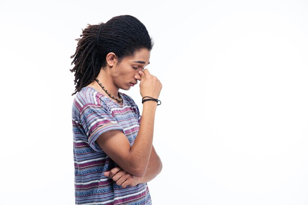 Side view portrait of a thoughtful afro american man standing isolated on a white backgroun