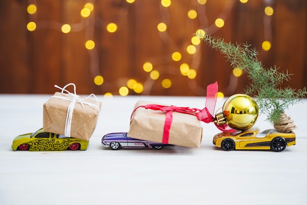 Photo side view of presents on toy cars