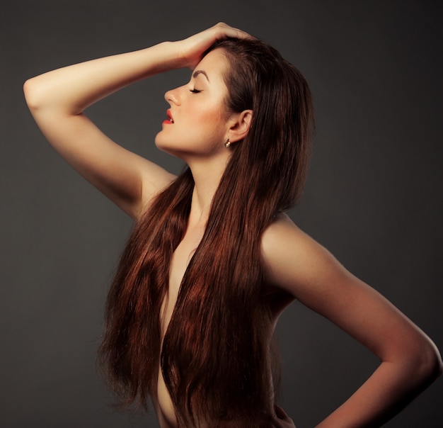 Side view of a pretty young brown-haired girl