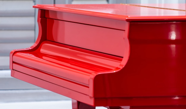 Side view of a Red Grand piano closed cover