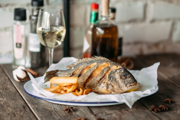 Side view roasted dorada fish restaurant dish