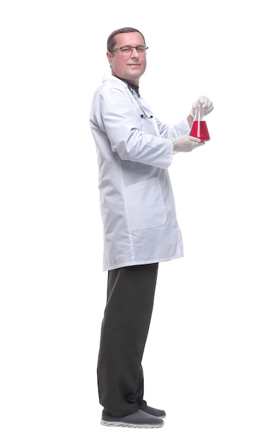 Side view scientist looking at a liquid in a laboratory flask