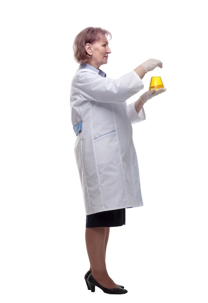 Side view senior female doctor with a laboratory flask isolated on a white