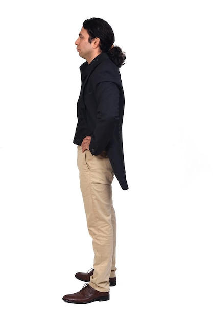 Side view of a serious man with shirt shoes and blazer on white background