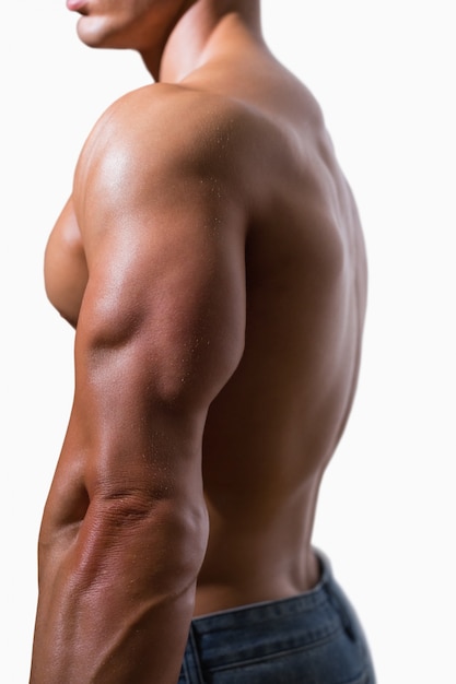 Side view of a shirtless muscular man