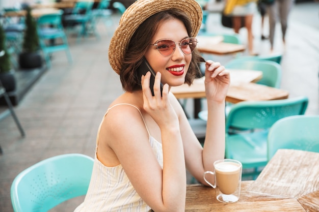 Side view of Smiling talking by smartphone