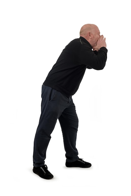 side view of a standing man who is screaming on white background