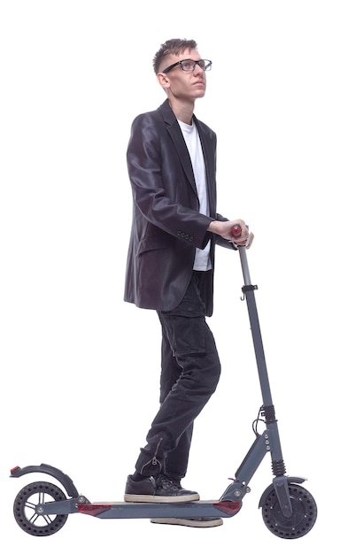 side view student guy with an electric scooter looking at you