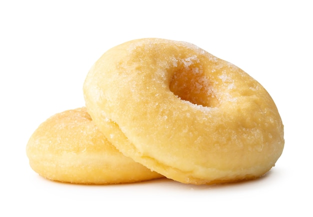 Side view of two sugar glazed cinnamon donuts in stack isolated on white background