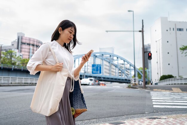 Side view woman checking her phone