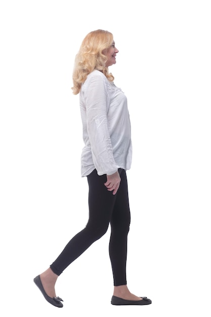 Side view woman in comfortable clothing striding forward