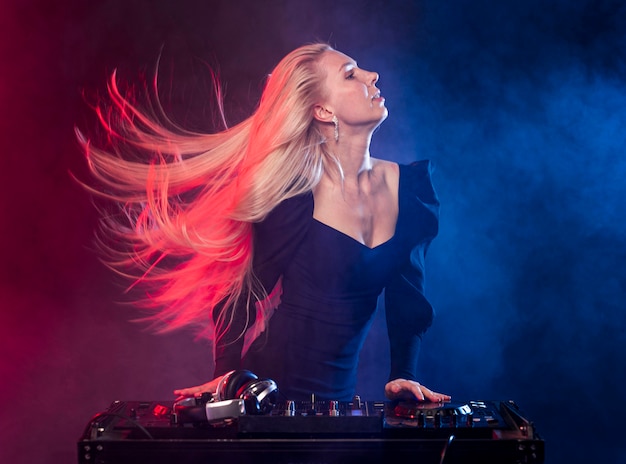 Side view woman at dj console