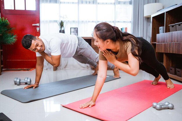 Side view of woman exercising in gym