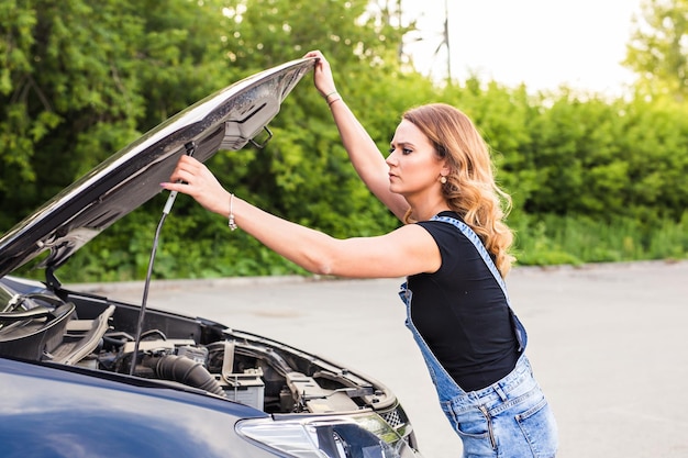 Side view of woman holding a car