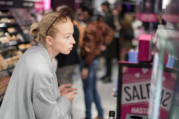 Side view of woman looking at store