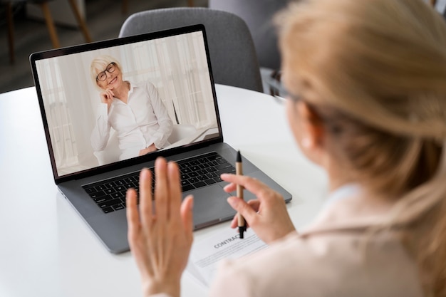 Side view woman making a video call