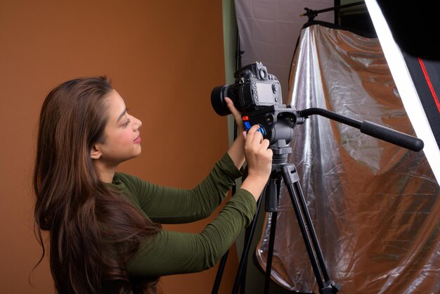 Side view of woman photographing