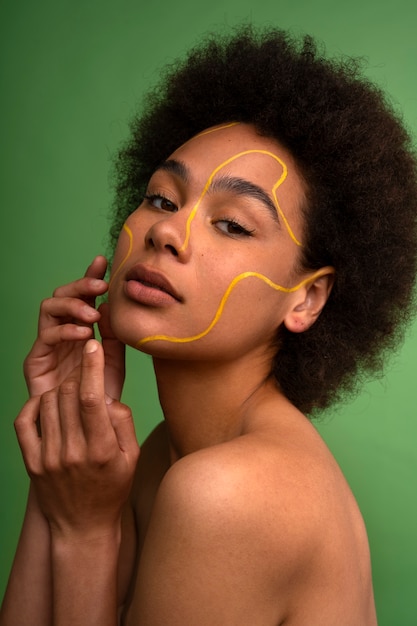 Side view woman posing with green background