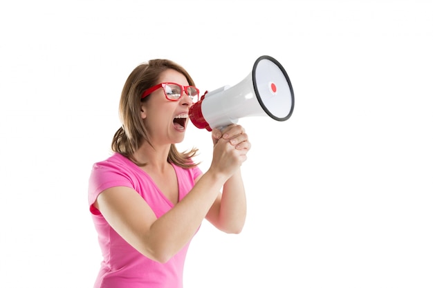 Side view of woman shouting into bullhorn