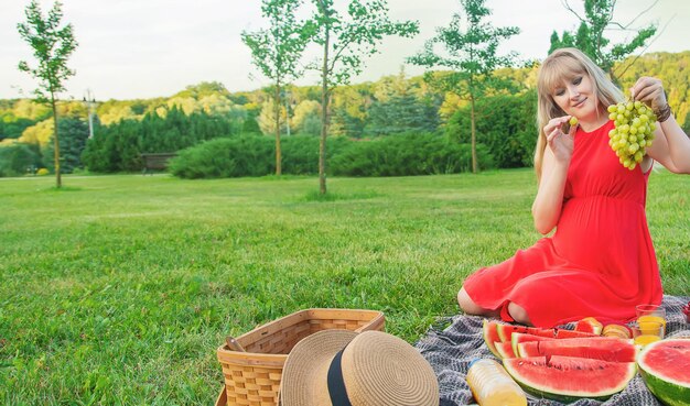 Side view of woman sitting on field