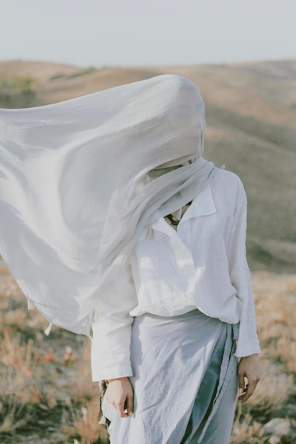 side view of woman standing on field