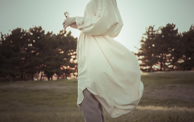 side view of woman standing on field