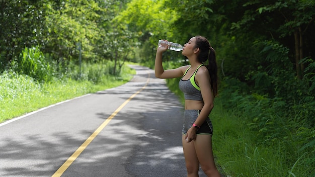 Side view of woman standing on road