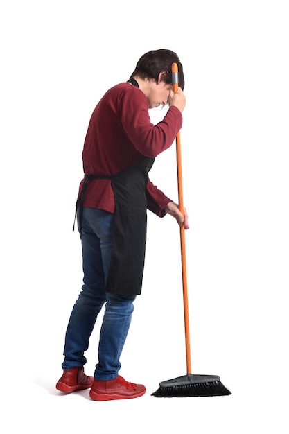 Photo side view of a woman sweeping on white background