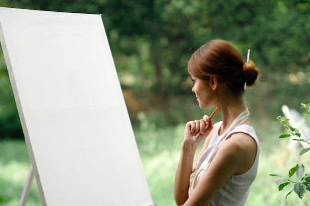 Side view of woman using digital tablet