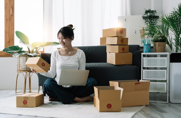 Side view of woman using laptop at home