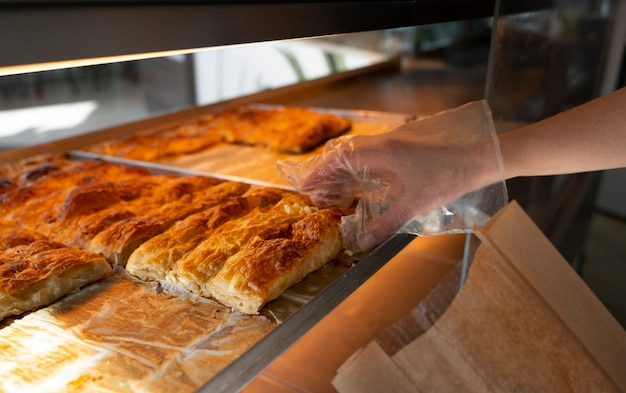 Side view woman working in bakery