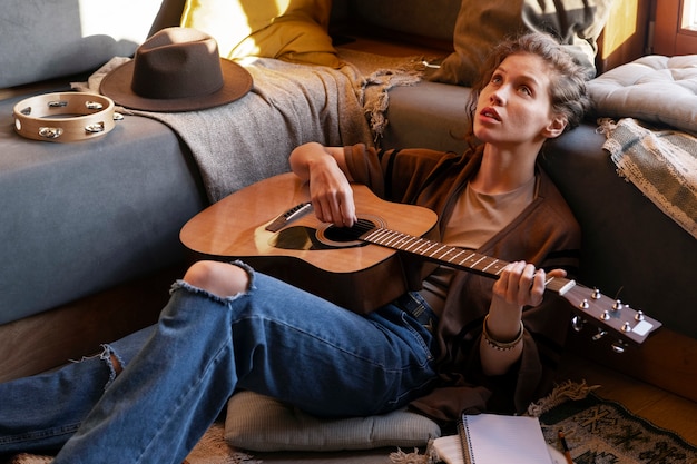 side view woman writing music